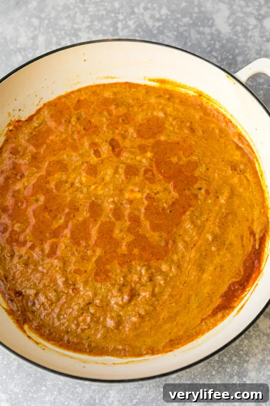 Simmer sauce and temper yogurt