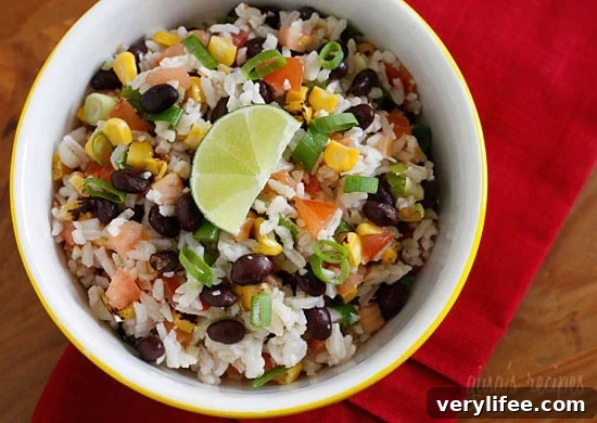 Rice, black beans, tomatoes, scallions, cilantro and lime juice — a colorful, bright side dish that tastes like a fiesta. Use leftover rice and this comes together in minutes.