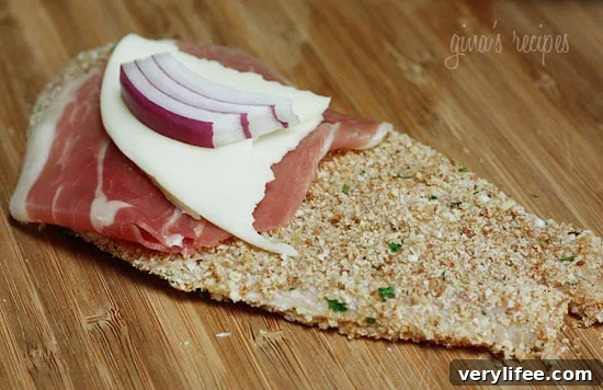 Chicken Rollatini Recipe with Prosciutto and Melted Cheese 5 Chicken Rollatini slice showing filling