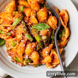 Baby Pasta Shells with Asparagus and Marinara Sauce is a quick and easy 4-ingredient pasta dish, perfect for Spring. Ready in under 15 minutes and under ten dollars to make.