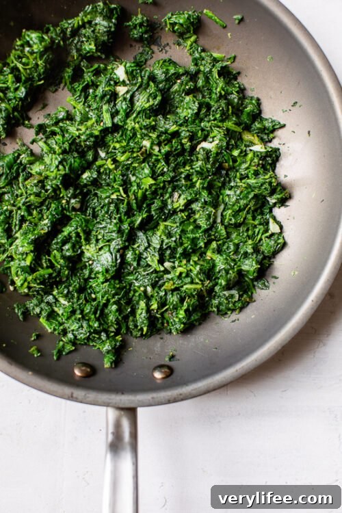Grilled Chicken with Spinach and Melted Mozzarella Recipe 4 spinach in a skillet