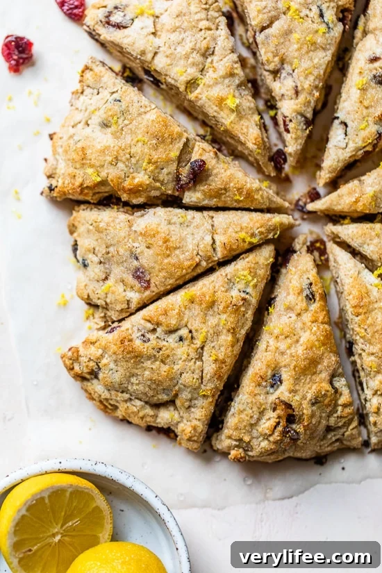 Buttery Lemon Cranberry Scones Recipe with Zesty Glaze 4 Baked scones cut in triangles