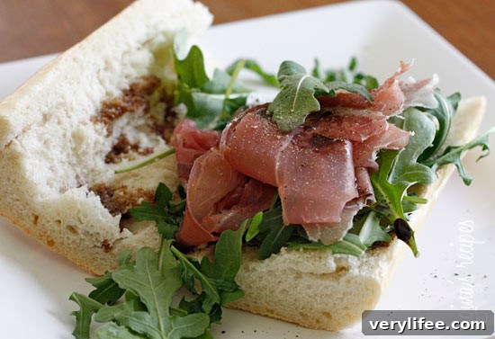 This prosciutto di Parma, peppery arugula, sweet balsamic and heart healthy olive oil on french bread is a winning combination.