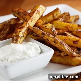 Skinny baked seasoned fries with garlic aioli