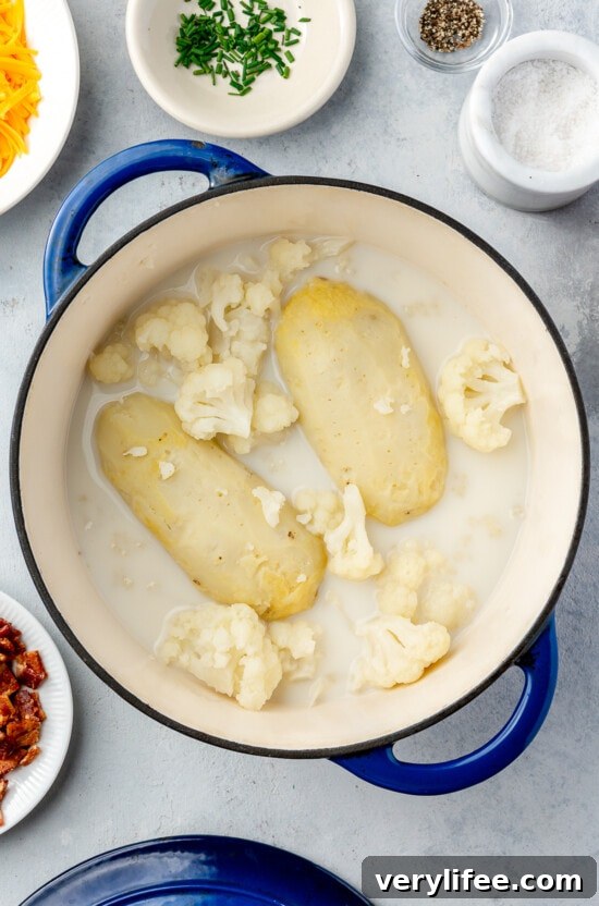 Pot with potatoes and cauliflower