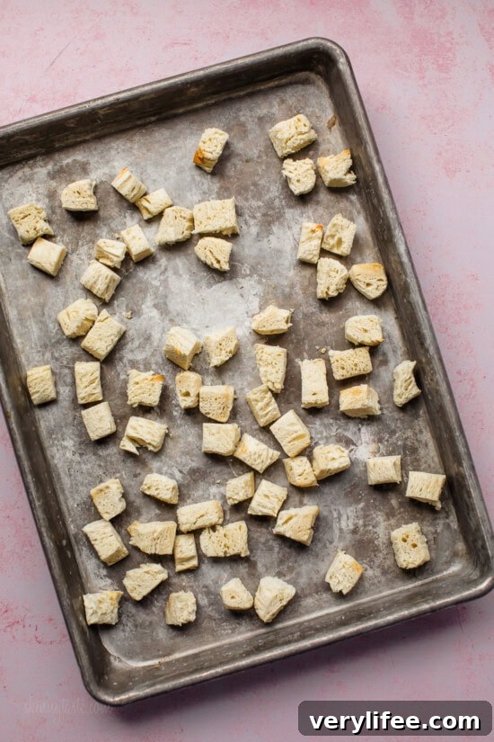 bread chunks on sheet pan