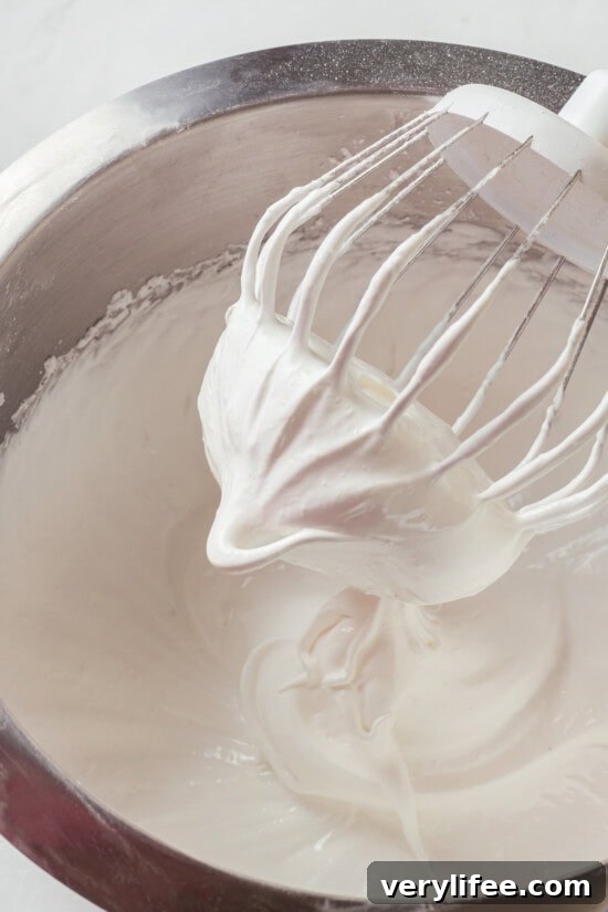 Whisk until glossy Whisk attachment whipping egg whites