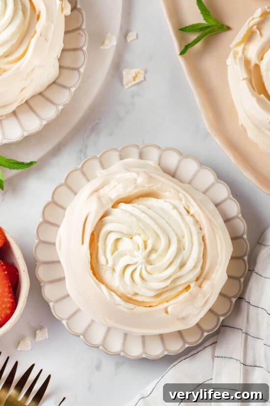 Fill with whipped cream Overhead view of pavlova filled with whipped cream