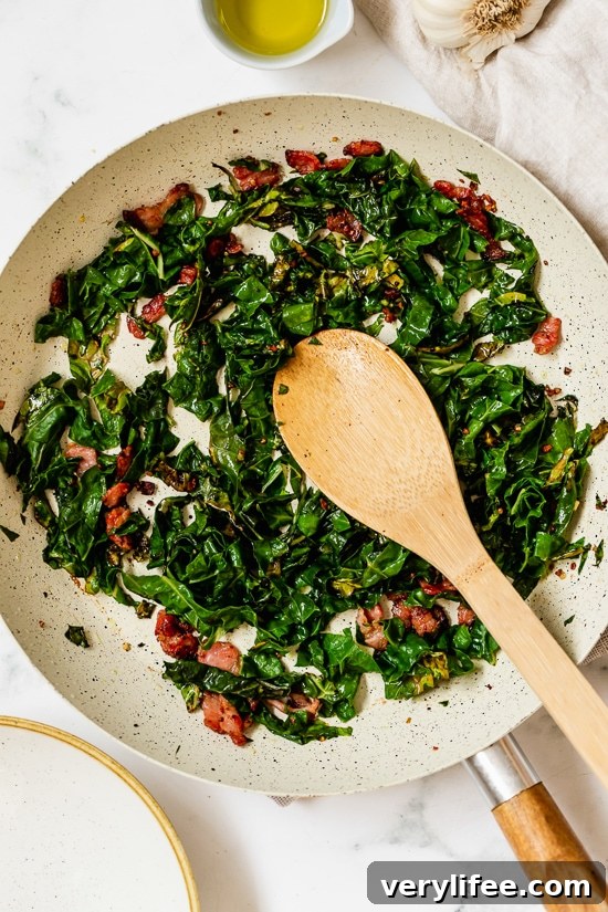Collard Greens and Bacon in a skillet.