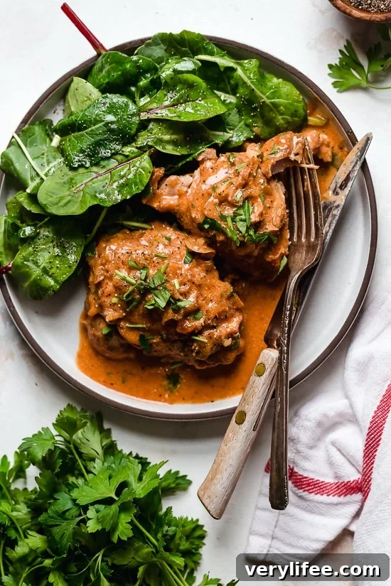 I lightened up this popular French chicken dish known as Poulet Au Vinaigre, which is made with chicken thighs and shallots cooked in red wine vinegar and white wine.