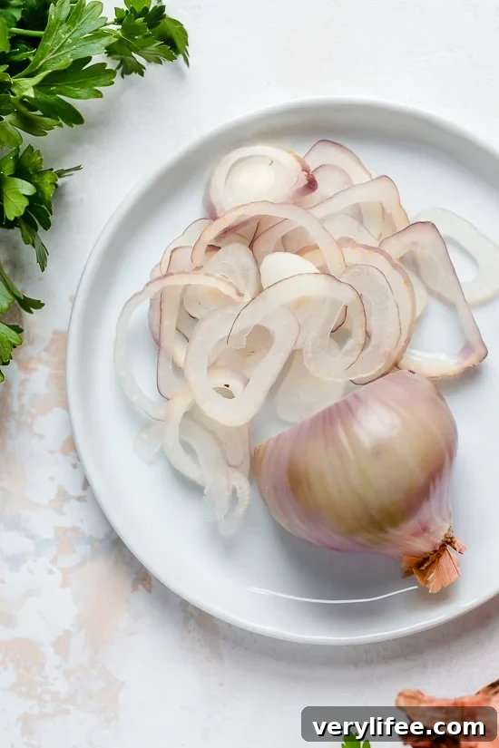 I lightened up this popular French chicken dish known as Poulet Au Vinaigre, which is made with chicken thighs and shallots cooked in red wine vinegar and white wine.