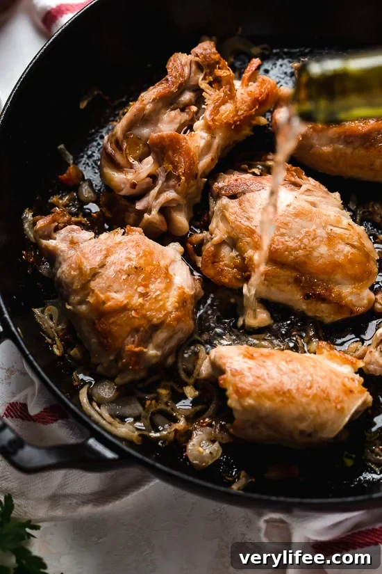 I lightened up this popular French chicken dish known as Poulet Au Vinaigre, which is made with chicken thighs and shallots cooked in red wine vinegar and white wine.