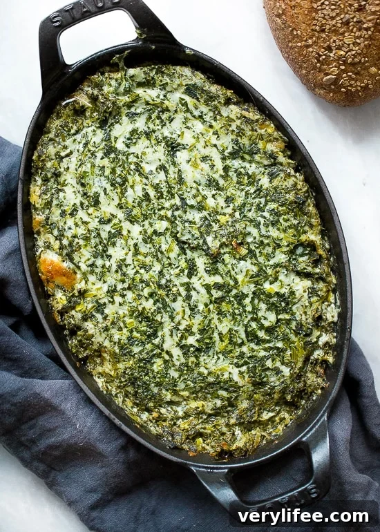 Overhead view of hot spinach dip in baking dish