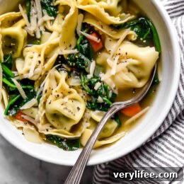 Spinach Tortellini en Brodo (in broth) is an Italian soup made with spinach and cheese tortellini and vegetables in a light broth.