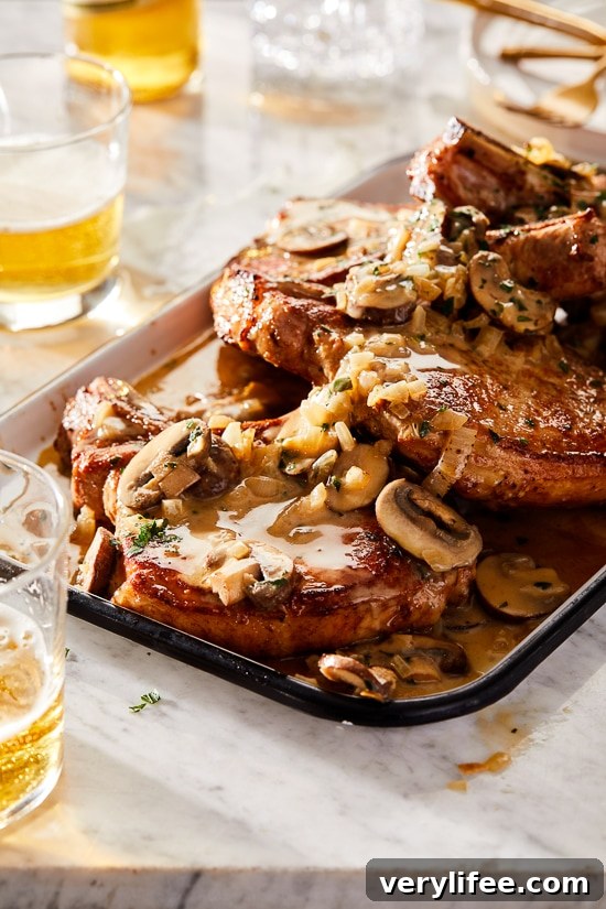 Pork chops in pan with mushrooms and shallots