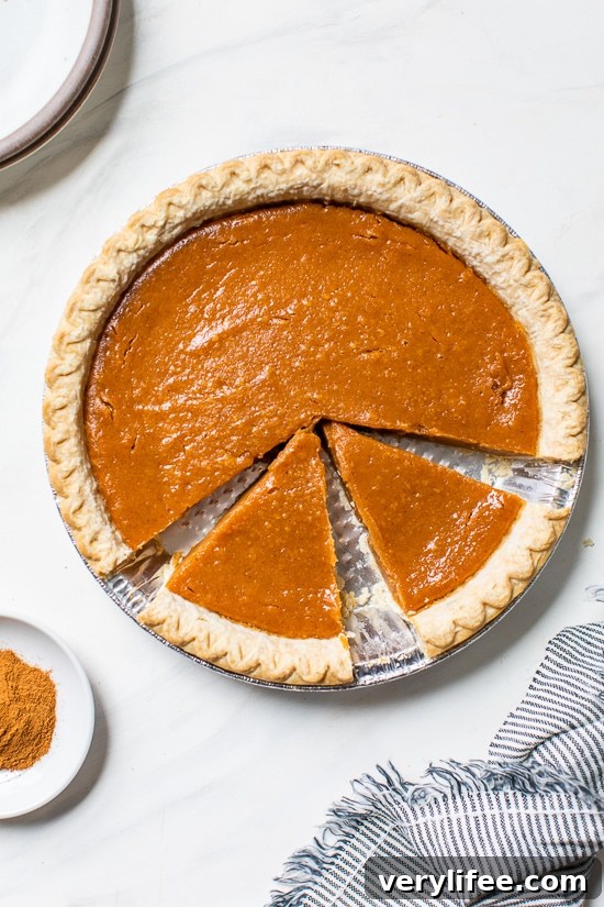 Lightened-Up Sweet Potato Pie Overhead view of sweet potato pie with two slices cut