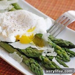 Steamed Asparagus with Poached Eggs Recipe 2 Poached eggs over steamed asparagus topped with shaved Pecorino Romano