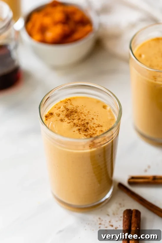 A pumpkin pie smoothie in a glass