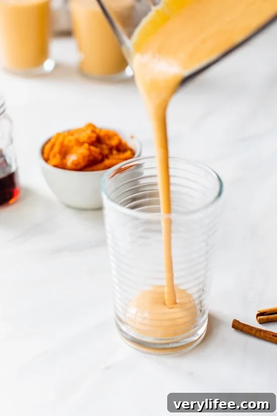 Pumpkin Smoothie being poured into a glass