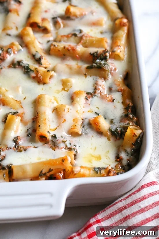 Baked ziti is a favorite comfort dish in my home! Adding spinach is a quick and easy way to get more leafy greens into your family's diet without complaints.