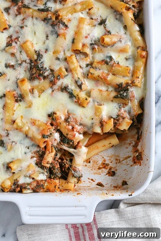 Baked ziti is a favorite comfort dish in my home! Adding spinach is a quick and easy way to get more leafy greens into your family's diet without complaints.