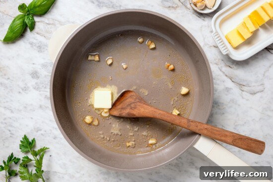 Tender Steamed Clams with Garlic and White Wine 6 Butter melting in pan with wine and garlic.