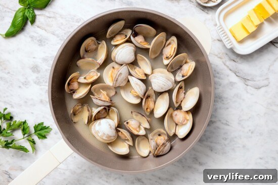 Tender Steamed Clams with Garlic and White Wine 8 Skillet of steamed clams.