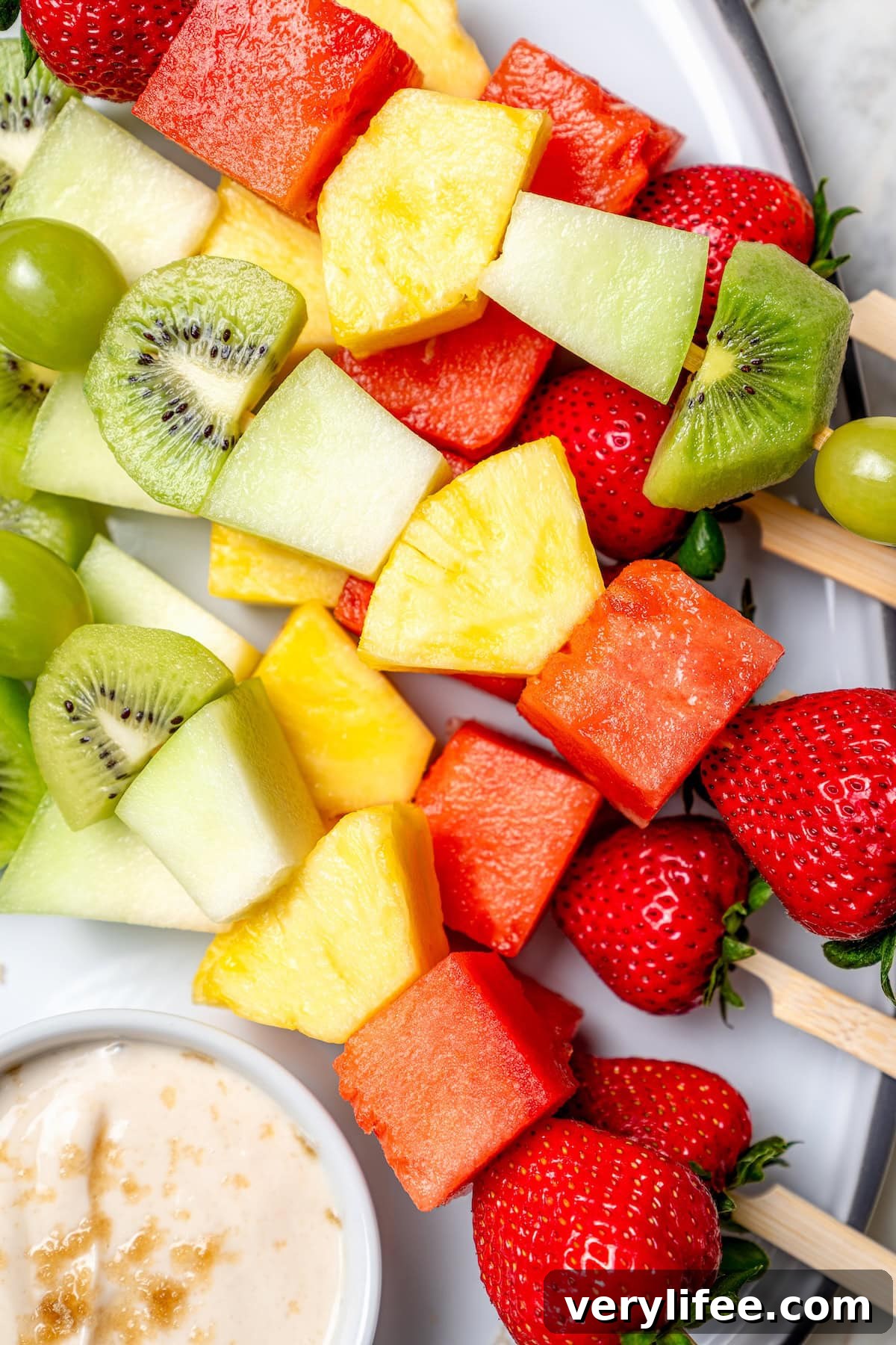 Rainbow fruit kabobs on platter