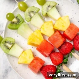 Overhead view of fruit kabobs on platter