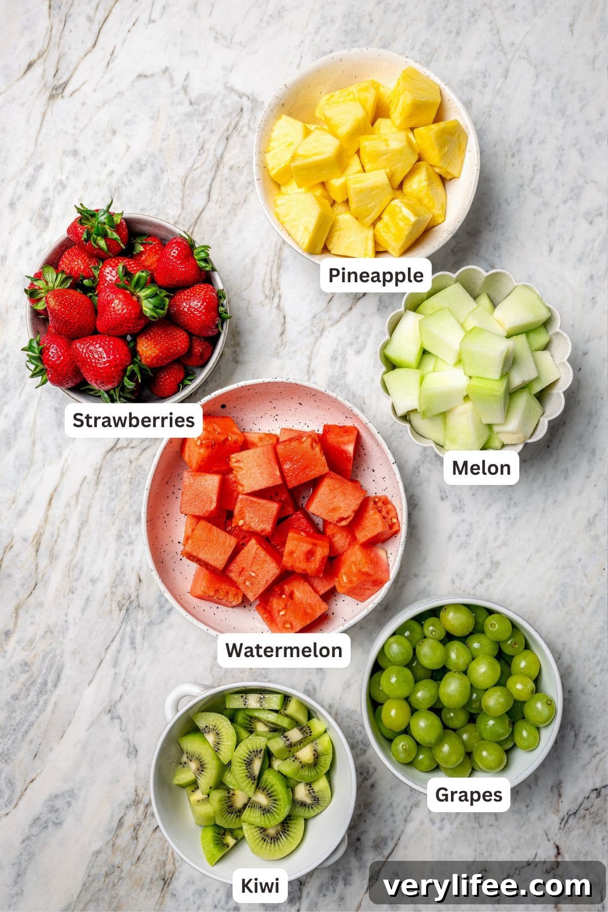 Overhead view of ingredients for fruit kabobs