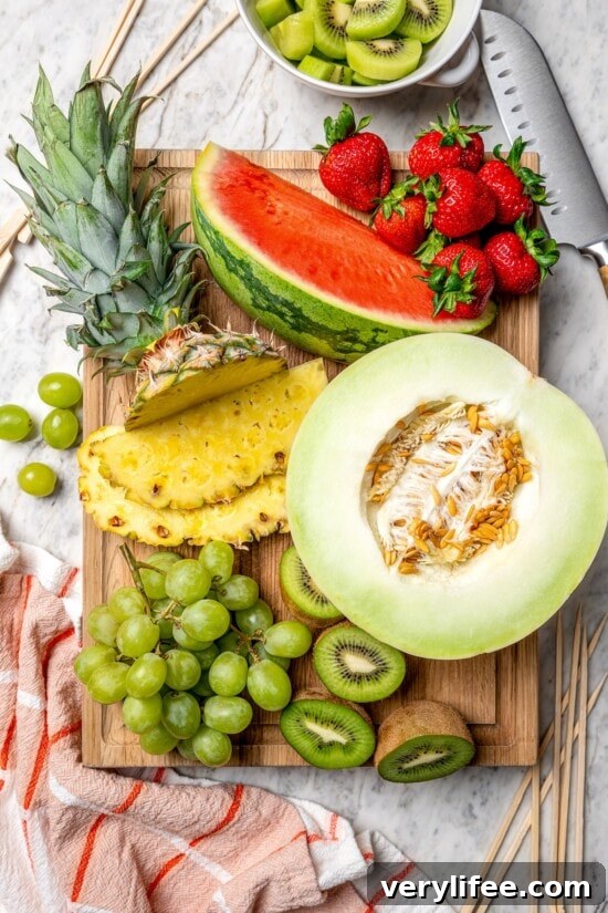 Overhead view of fresh fruit on cutting board