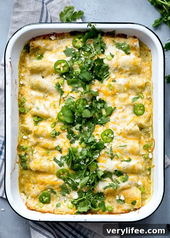 Creamy Salsa Verde Chicken and White Bean Enchiladas 2 White beans, shredded chicken, green chiles, sour cream and cheese – need I say more?