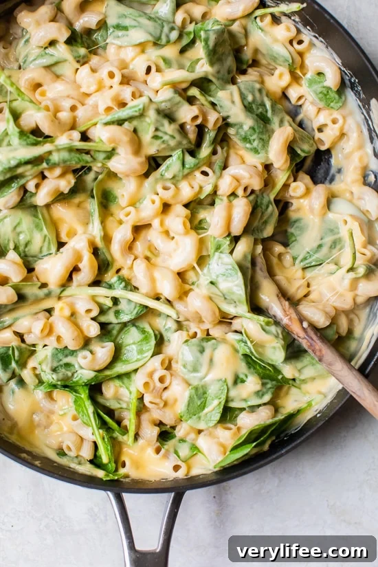 Add the cooked macaroni and spinach.