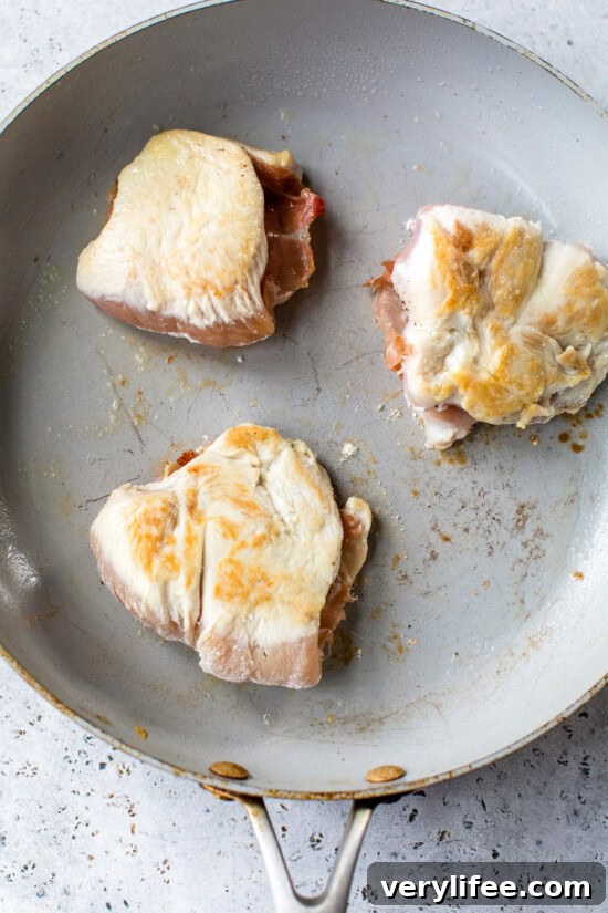 Chicken saltimbocca cooking in skillet