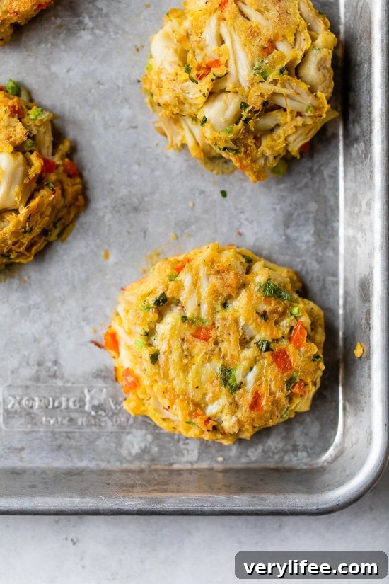 Bake crab cakes Baked crab cakes on a baking sheet.