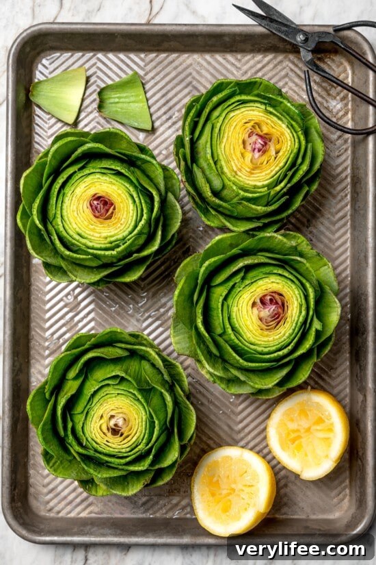 Garlic-Parmesan Stuffed Artichokes Recipe 4 Overhead view of prepped artichokes on pan