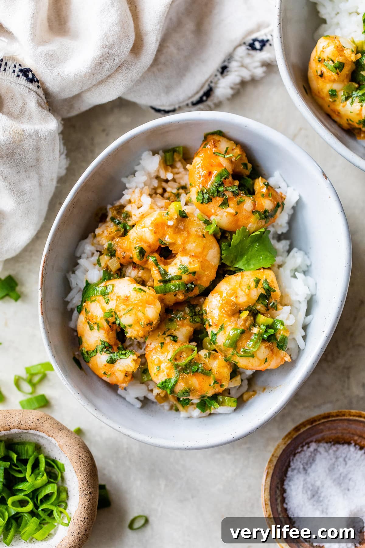 Creamy Red Thai Coconut Curry Shrimp 2 shrimp over rice in a bowl