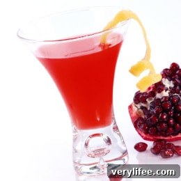 Pomegranate Martini in a chilled martini glass with a citrus twist