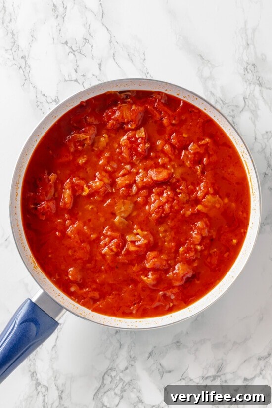Crushed and canned tomatoes in a pan