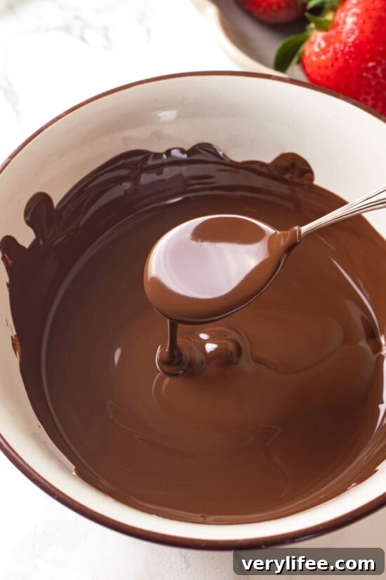 Melt the chocolate Spoon dripping melted chocolate into bowl