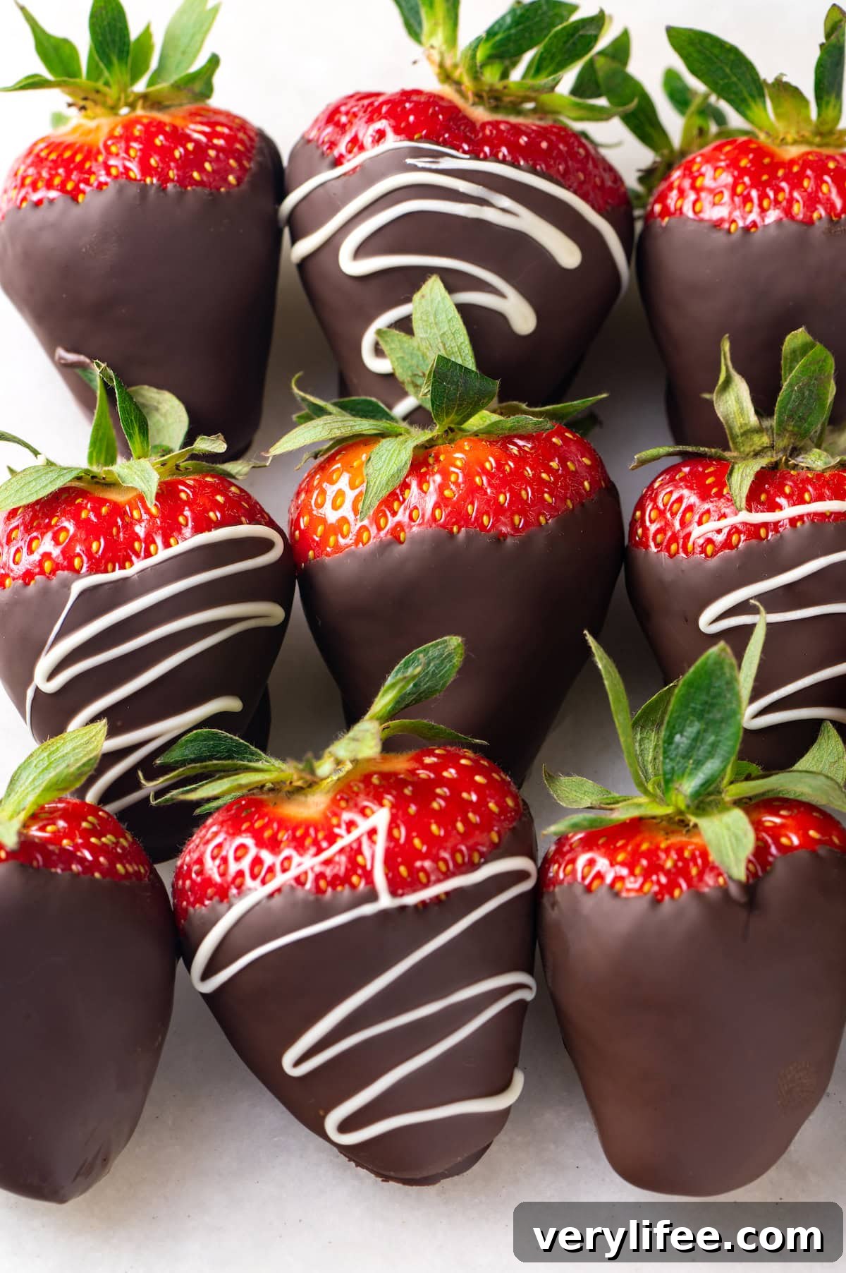 Chocolate-covered strawberries arranged Chocolate-covered strawberries in three rows of three