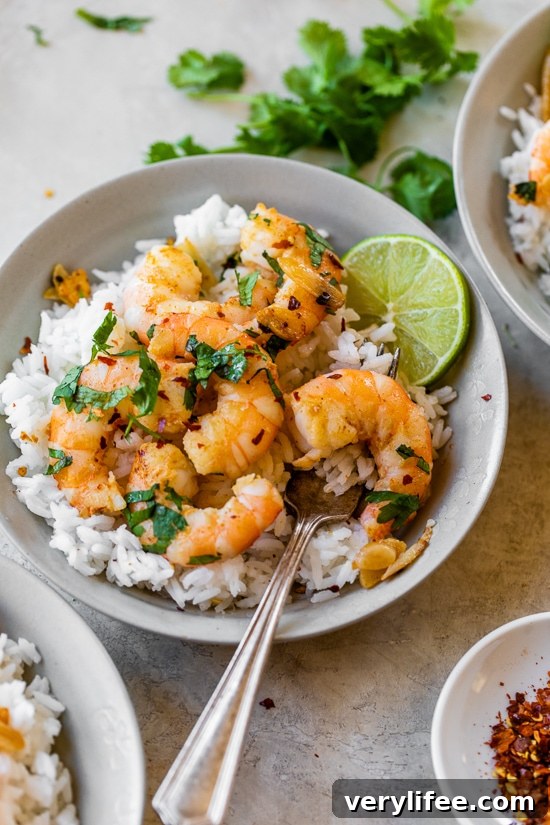 Garlic Butter Shrimp with Lemon and Parsley Recipe 5 shrimp with rice in a bowl