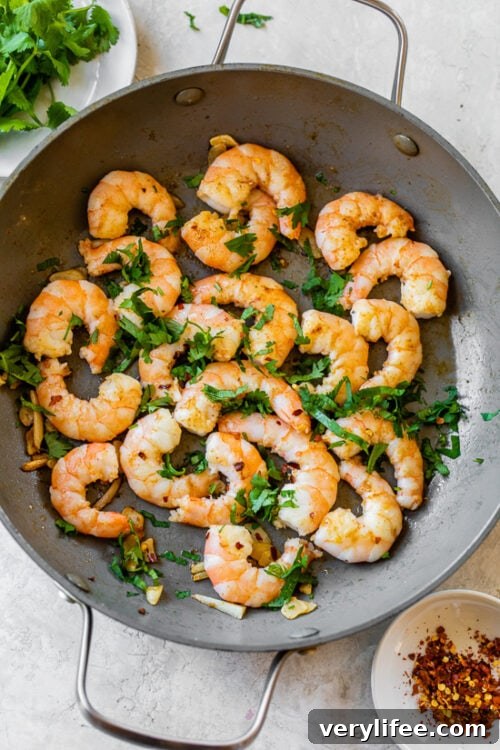 Garlic Butter Shrimp with Lemon and Parsley Recipe 8 shrimp and parsley in skillet