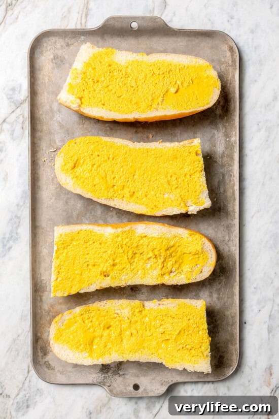 French bread spread with mustard