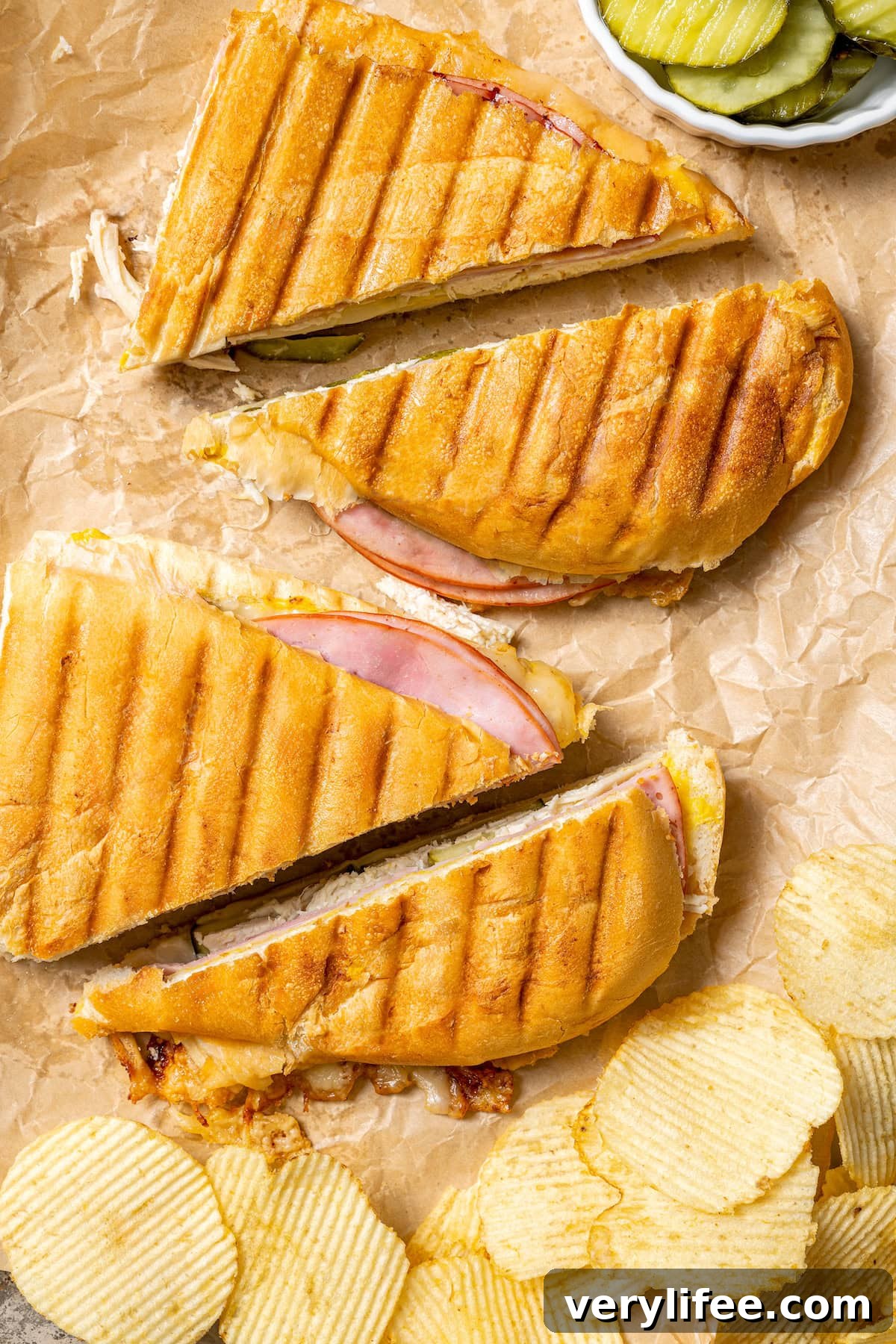 2 turkey Cuban sandwiches sliced in half