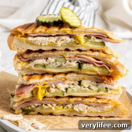 Stack of leftover turkey Cuban sandwiches on plate