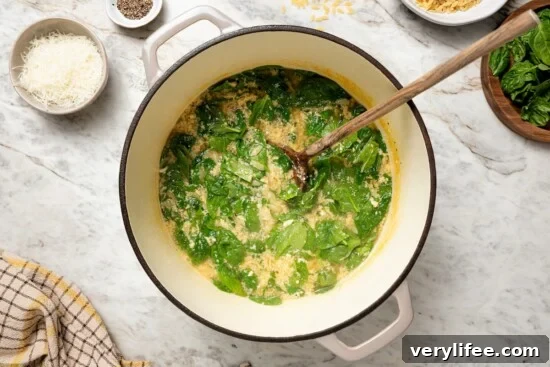 Classic Italian Stracciatella Soup with Spinach and Orzo 8 Pot of stracciatella soup with spinach.