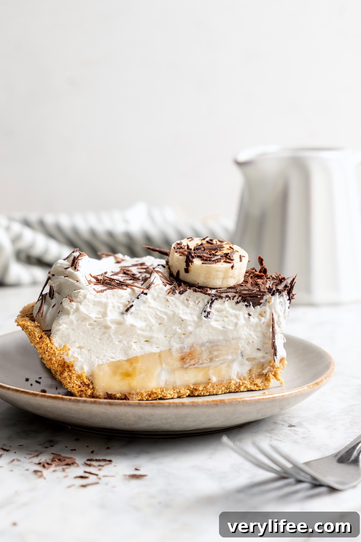 No-Bake Banana Cream Pie Recipe 10 Slice of no bake banana cream pie on plate.
