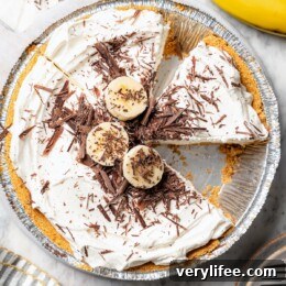 No-Bake Banana Cream Pie Recipe 4 Overhead view of banana cream pie with one slice removed.