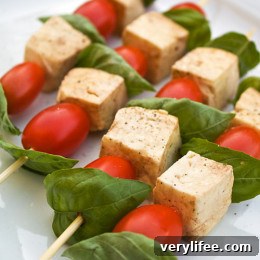 Close-up of tomato, basil and mozzarella skewers